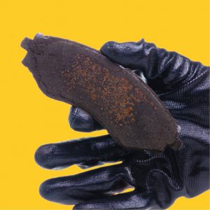 Corrosion present on brake pad backing plate