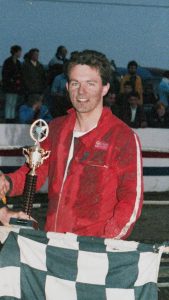 Graham France holding a trophy in the 1980s.