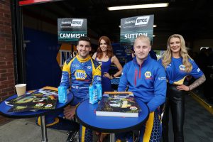 Cammish and Sutton pose for a photo together while signing autographs at BTCC Brands Hatch