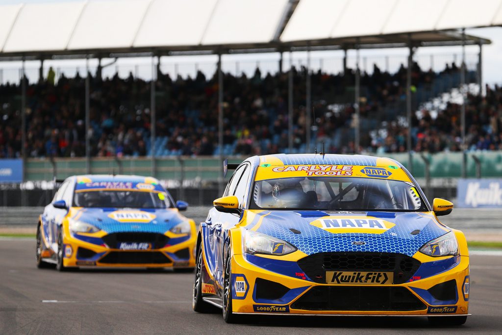 Sutton's NAPA Racing UK Ford Focus ST leads teammate Dan Cammish along the grid