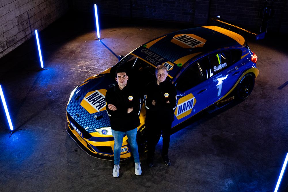 Dan Cammish and Ash Sutton stand in front of the sleek NAPA Ford Focus in the BTCC livery reveal.