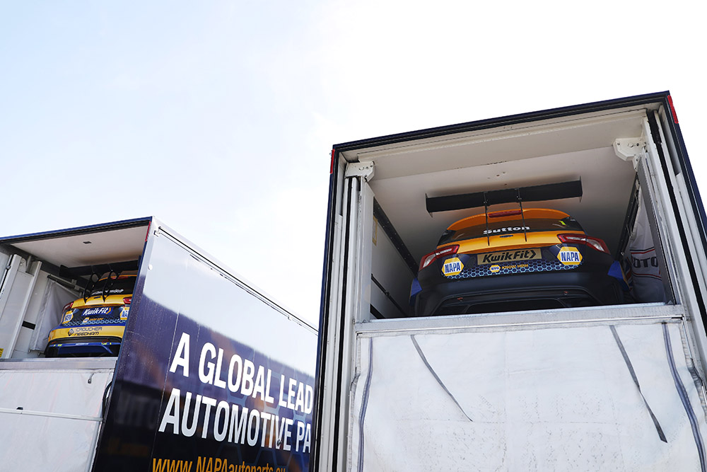 The NAPA Racing UK Ford Focuses loaded up in the back of two NAPA trucks.