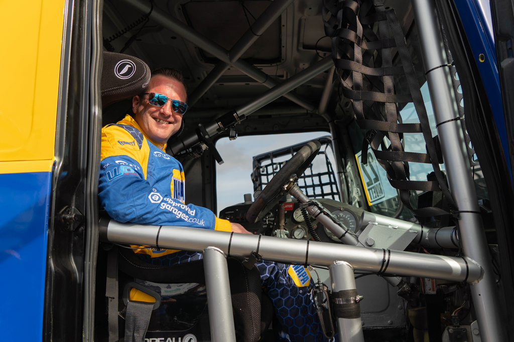 Paul Rivett sits inside the driver's cabin of the NAPA Racing Truck